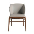 Stylová jídelní židle Forma Moderna kombinuje šedé eko-kožené čalounění s přírodním ořechovým provedením nožiček